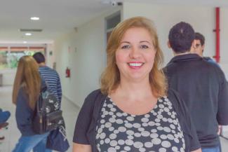 Carla Pousa standing in FSU Panama's hallway