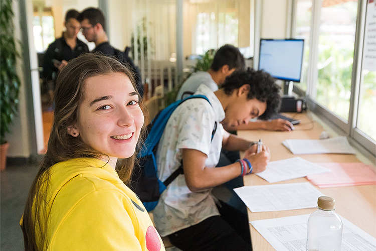 Students filling out admissions form