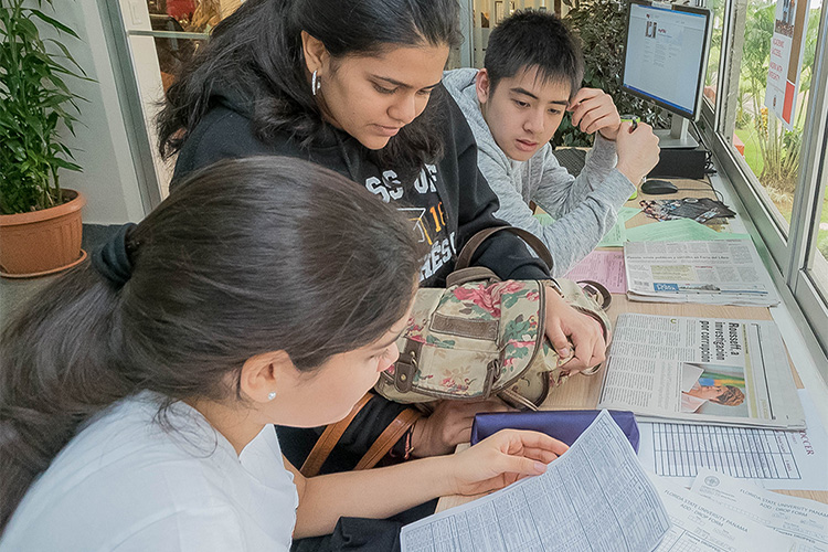 Students reviewing application information